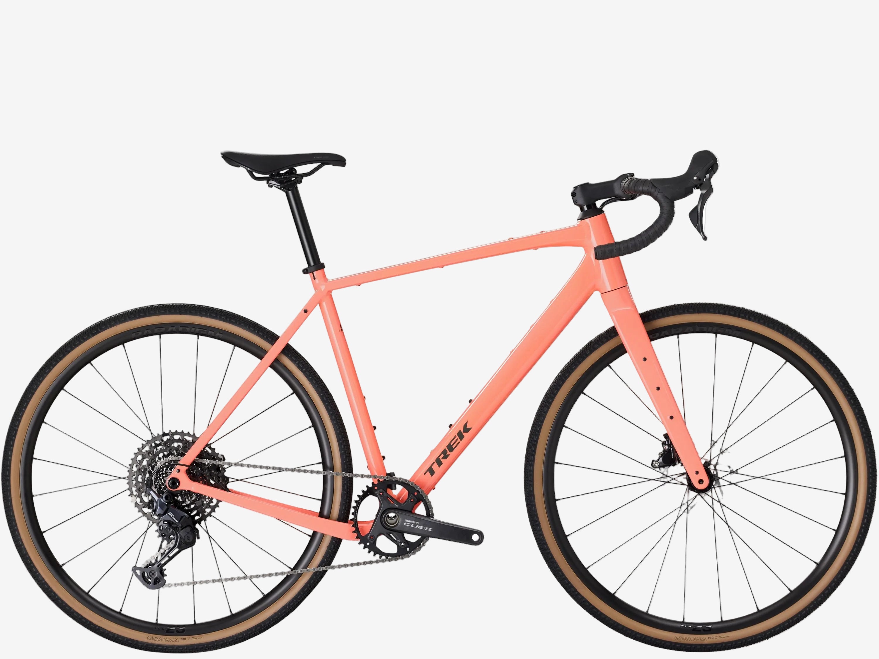 Coral bicycle with black components on a white background