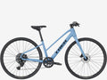 Blue bicycle with 'Trek' branding on a white background