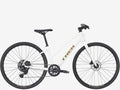 White bicycle with 'Trek' branding on a white background