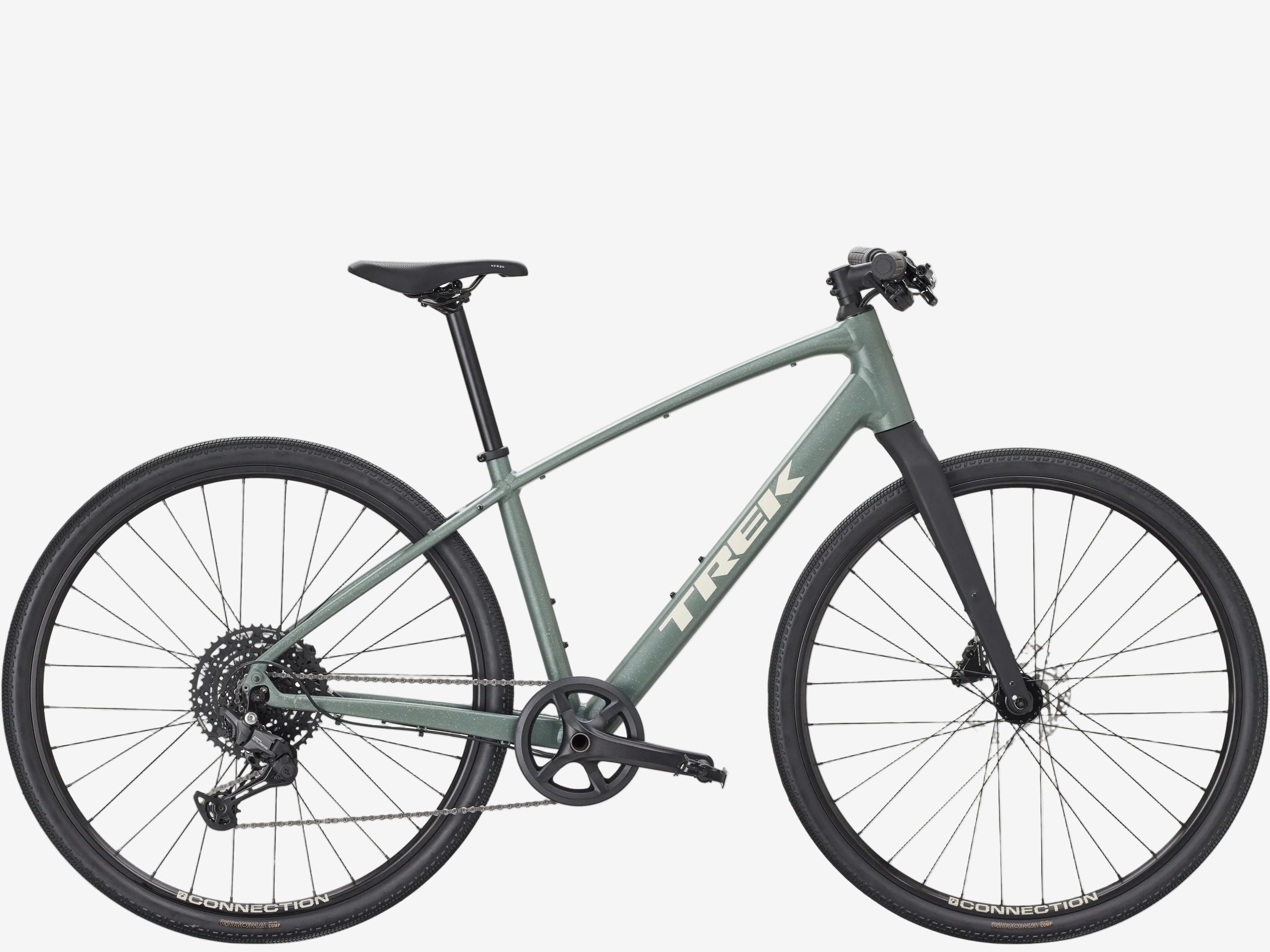 Green bicycle with 'Trek' branding on a white background