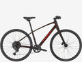 Black bicycle with red accents on a white background