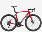 Red bicycle with black components on a white background