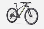 Black mountain bike with green accents on a white background