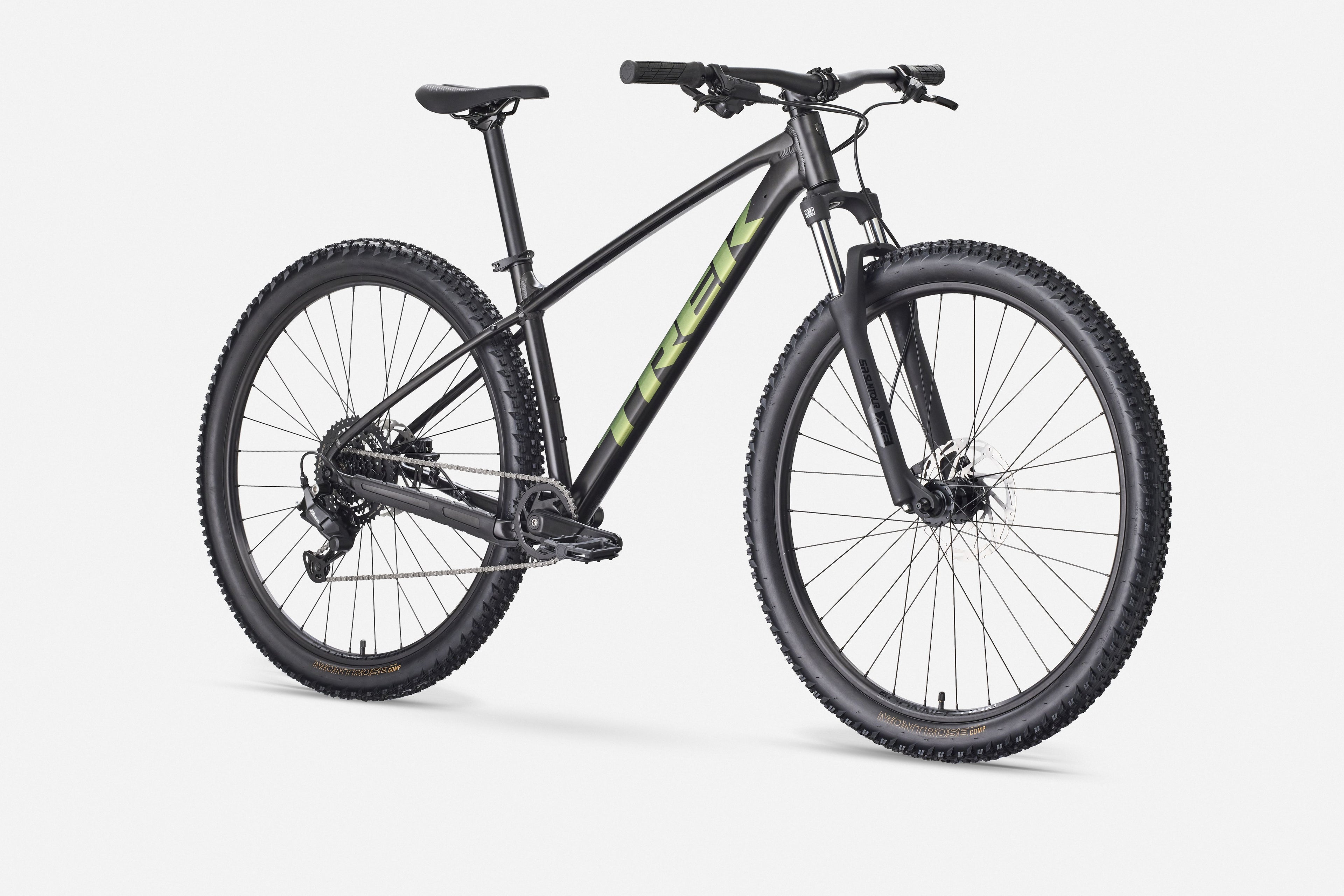Black mountain bike with green accents on a white background