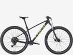 Mountain bike with 'Trek' branding on a white background