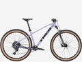Purple Trek bicycle on a white background