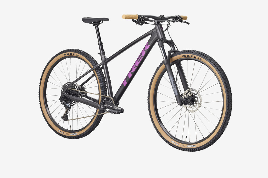 Mountain bike with black frame and purple accents on a white background