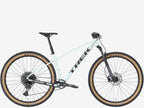 White mountain bike with black components on a white background