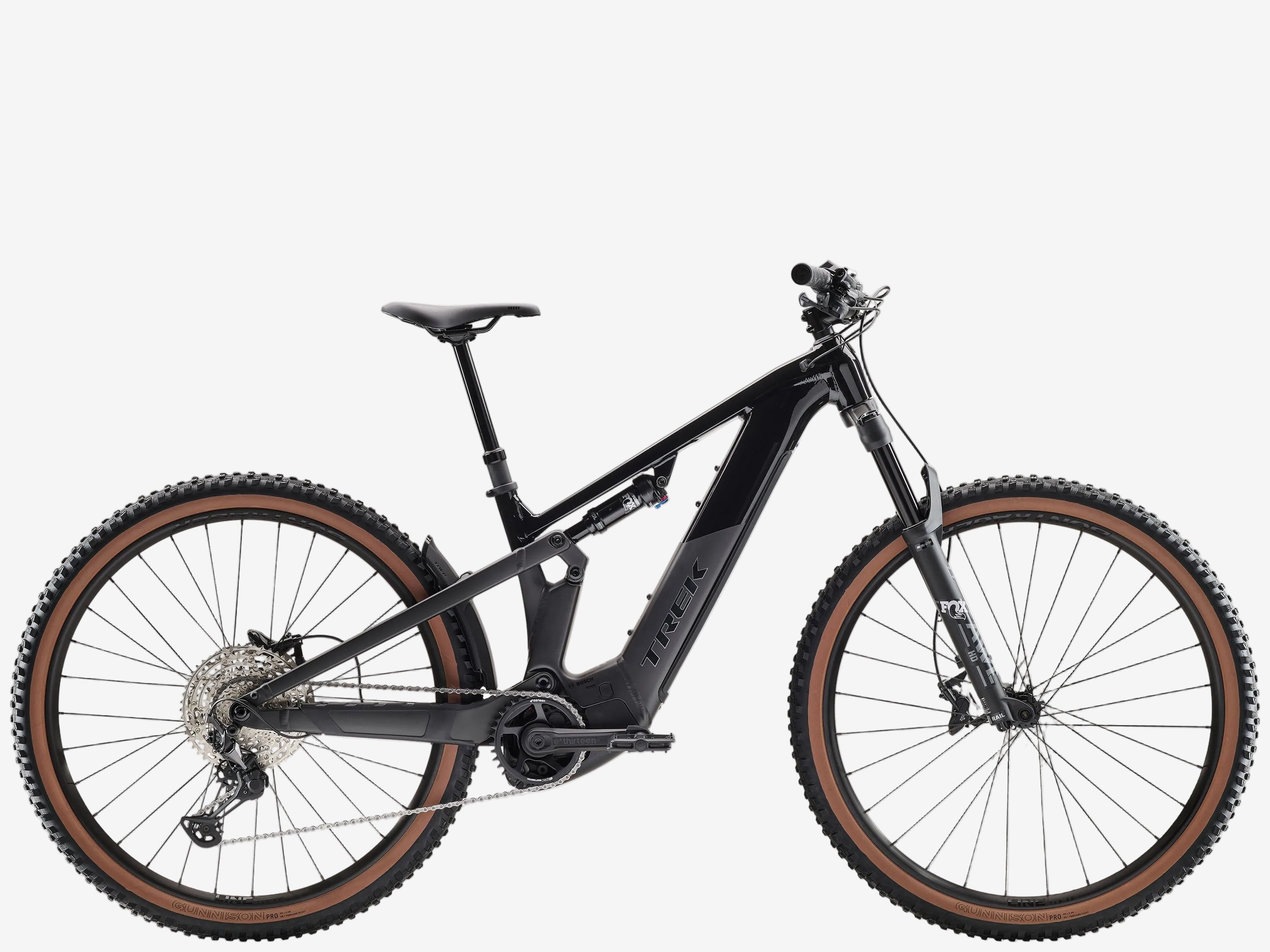 Black mountain bike with brown tires on a white background