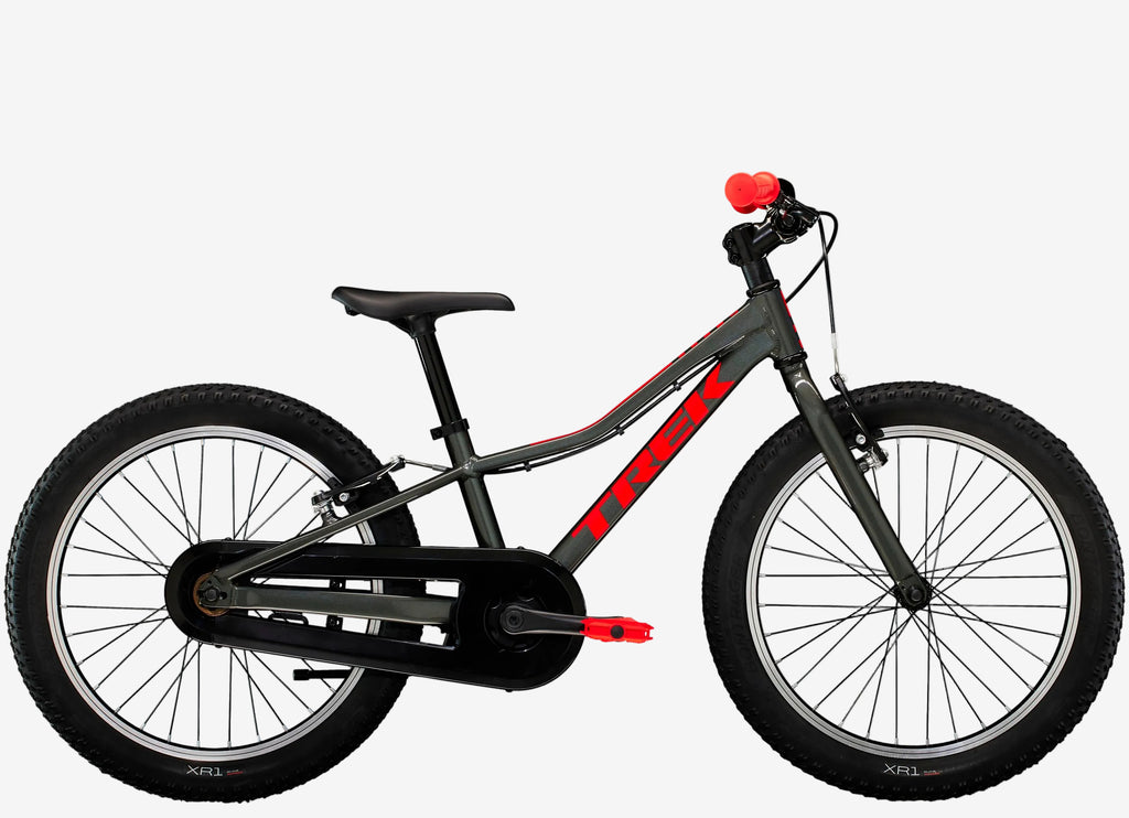 Children's bicycle with black frame and red accents on a white background