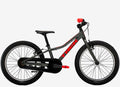 Children's bicycle with black frame and red accents on a white background