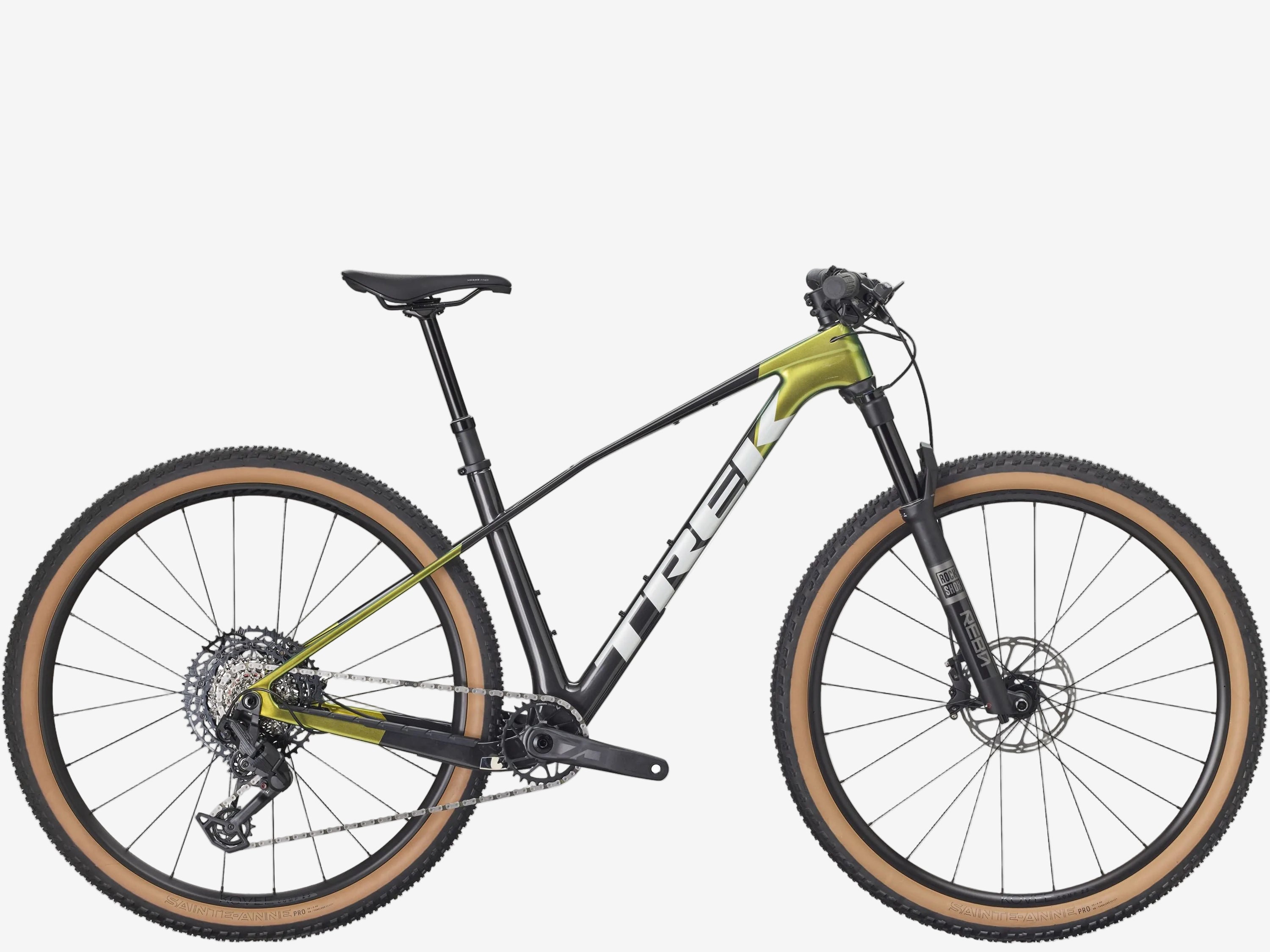 Mountain bike with green frame and brown tires on a white background