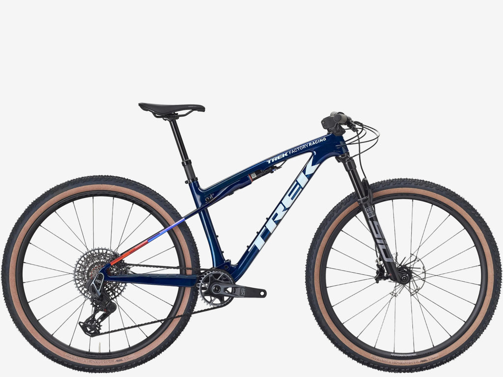 Blue bicycle with brown tires on a white background