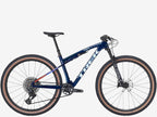Blue bicycle with brown tires on a white background