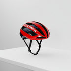 Red bicycle helmet with black accents and 'Trek' branding on a white background
