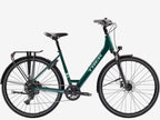 Green bicycle with black accents on a white background