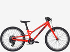 Red children's bicycle on a white background